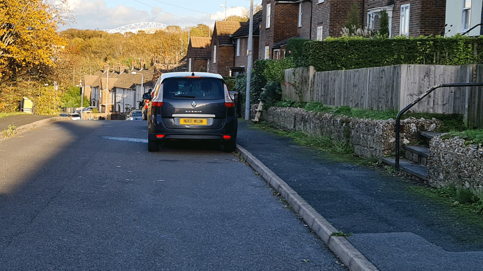 Car in the street where there is free parking in Brighton